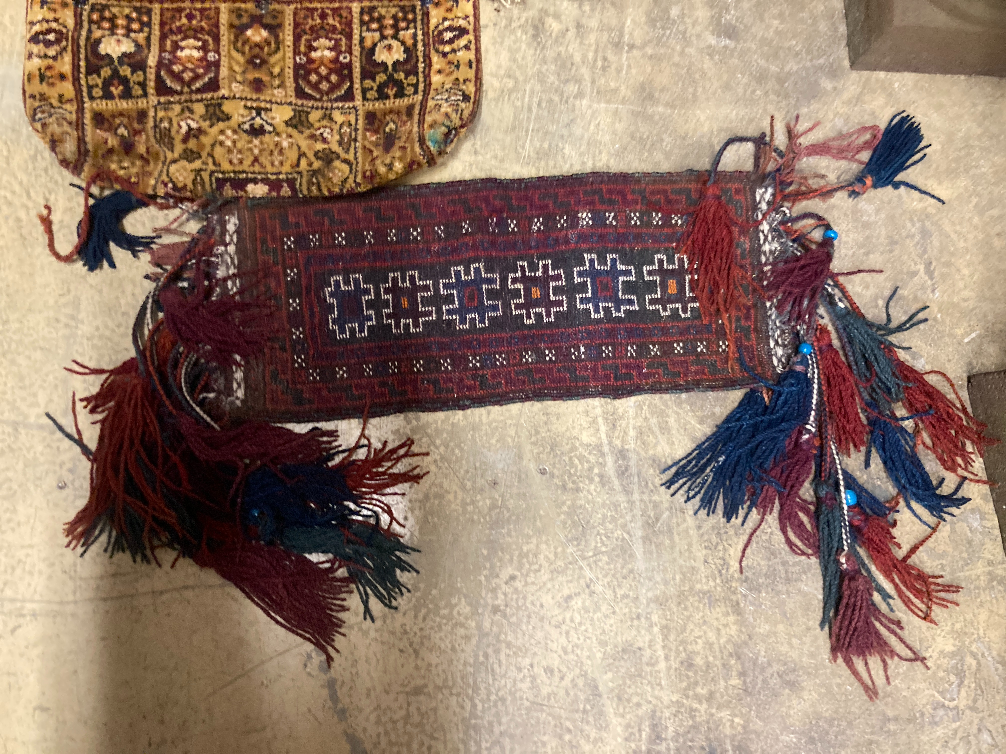 A Bokhara wall hanging 54 x 70 cms, one other, two Bokhara mats and bag.